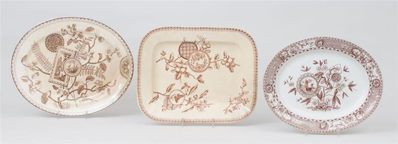 Appraisal: THREE AESTHETIC MOVEMENT EARTHENWARE PLATTERS IN THE 'ALGERIE' 'SITKA' AND