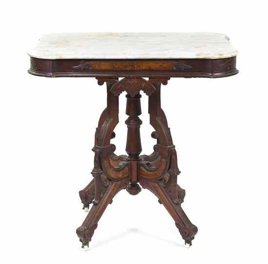 Appraisal: A Victorian Walnut Occasional Table having a rectangular marble top