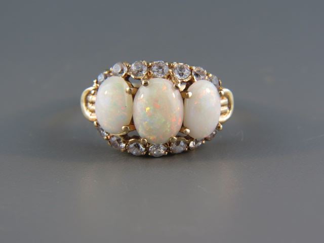 Appraisal: Opal Ring a trio of fiery oval gems totaling carats