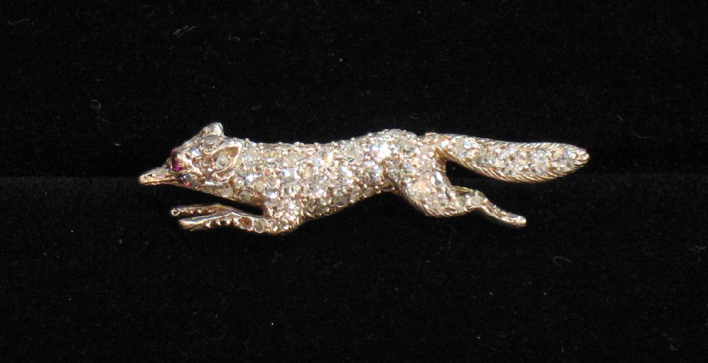 Appraisal: A DIAMOND BROOCH in the form of a running fox