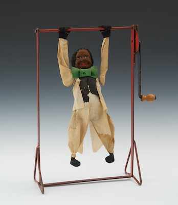 Appraisal: A Black Americana Hand Crank Trapeze Toy ca - Apprx