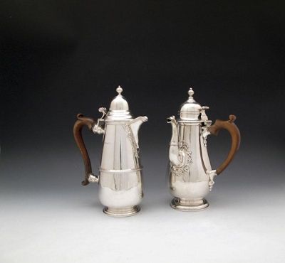 Appraisal: A silver coffee pot and similar silver hot water pot