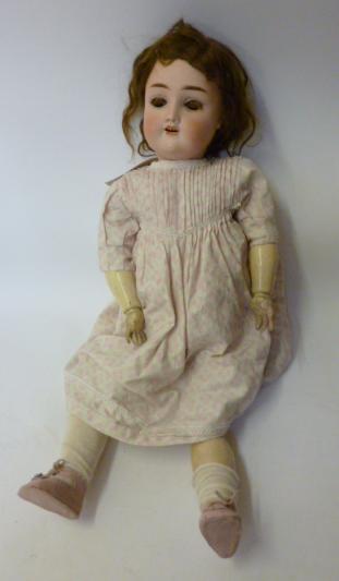 Appraisal: A Theodor Rechnagel bisque head girl doll with brown glass