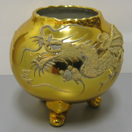 Appraisal: CORALENE PORCELAIN VASE With allover gold finish decorated with a