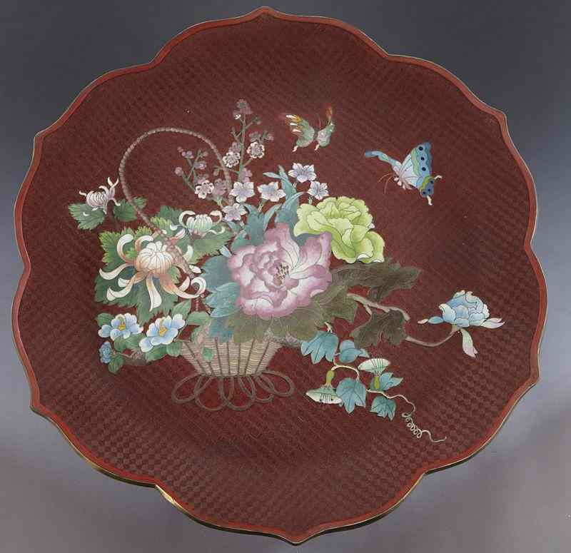 Appraisal: Chinese carved cinnabar charger with a cloisonneflower basket in the