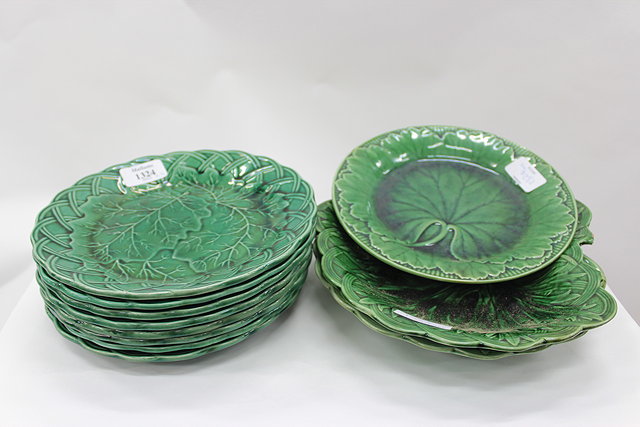 Appraisal: A SET OF EIGHT GREEN GLAZED MAJOLICA LEAF MOULDED PLATES