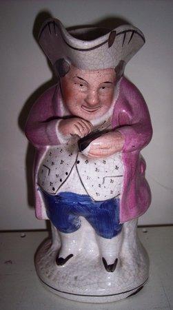 Appraisal: A th Century Staffordshire Toby jug modeled as a snuff