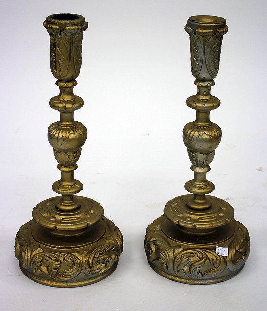 Appraisal: A PAIR OF CARVED AND GILT PAINTED CANDLESTICKS with acanthus