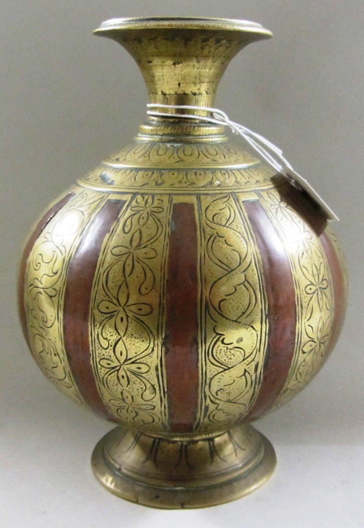 Appraisal: An Indian brass lota th century bulbous with flared neck