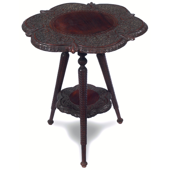 Appraisal: Cincinnati Art Carved table in walnut floral and serpent design