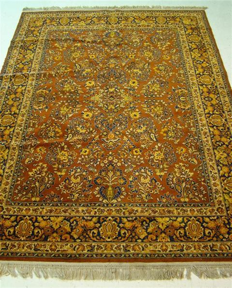 Appraisal: ORIENTAL STYLE BURNT ORANGE GROUND AREA RUG With details in