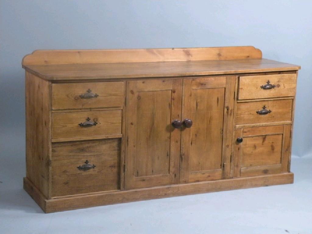 Appraisal: A late thC pine dresser base with a raised back