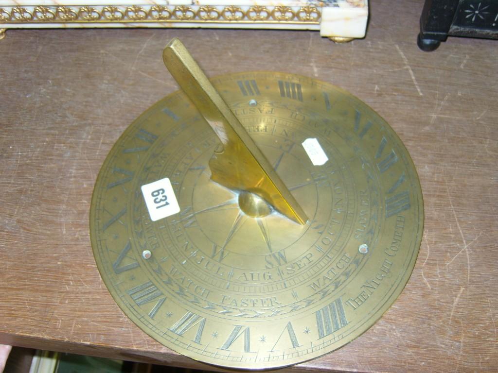 Appraisal: A Georgian brass sundial with engraved detail including compass months