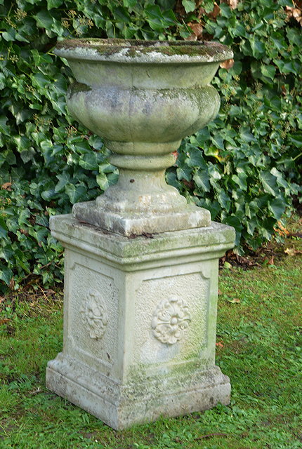 Appraisal: A RECONSTITUTED STONE GARDEN URN OF CAMPANA FORM together with