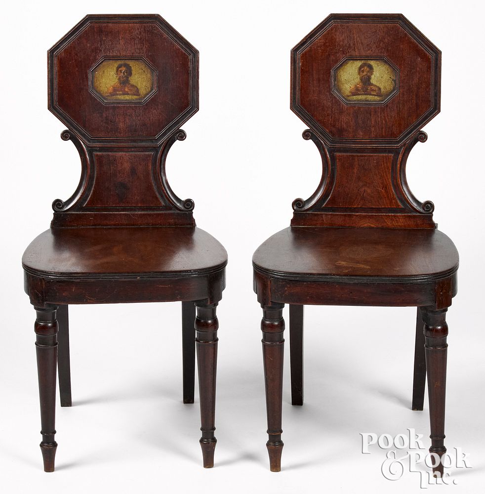 Appraisal: Pair of Italian mahogany hall chairs Pair of Italian mahogany