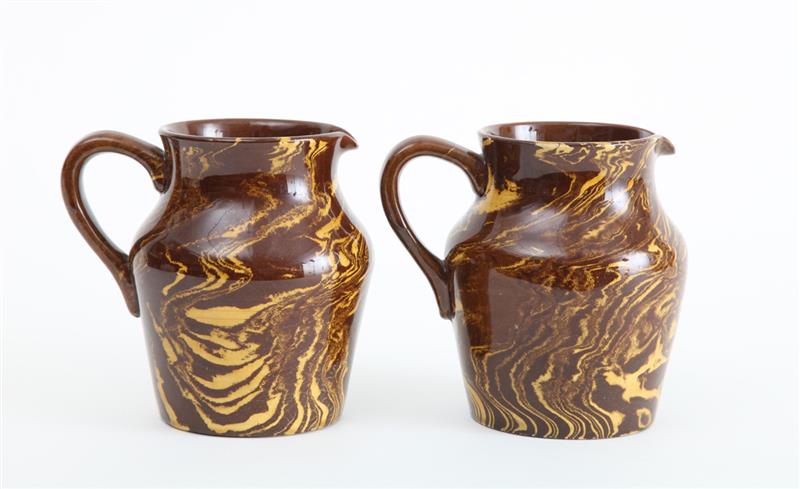 Appraisal: TWO ENGLISH BROWN POTTERY YELLOW-MARBLESIZED JUGS Unmarked Each in Provenance