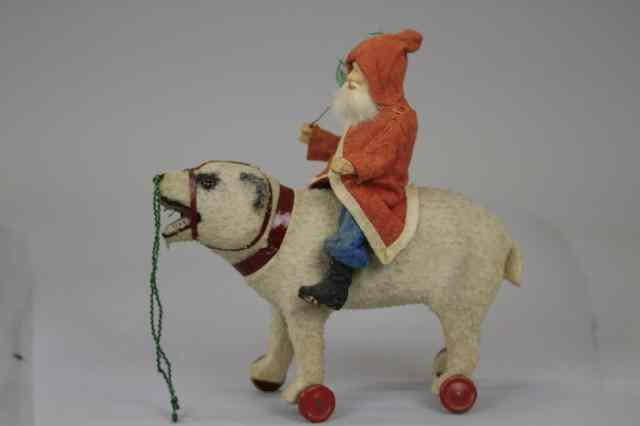 Appraisal: LARGE SANTA ON POLAR BEAR PULL TOY Germany Santa in