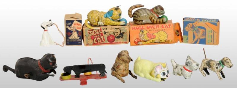 Appraisal: Lot of Cat Dog Friction Wind-Up Toys Description American English