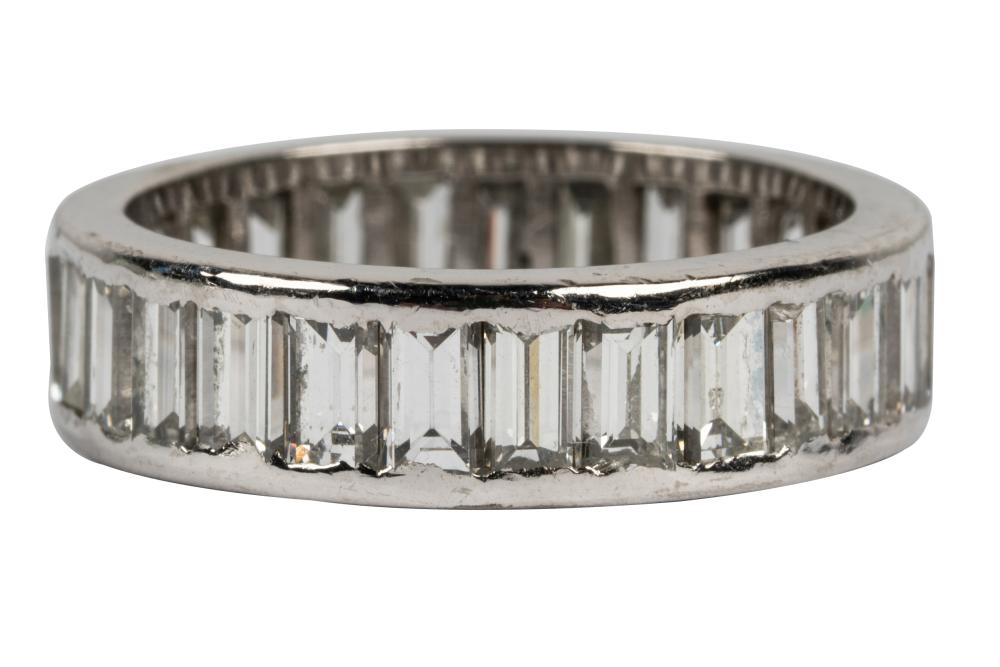 Appraisal: PLATINUM DIAMOND ETERNITY BANDcontaining baguette cut diamonds I VVS channel