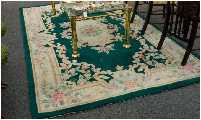 Appraisal: Floral Decorated Woolen Rug On A Green Background x Inches