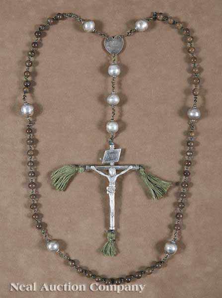 Appraisal: An Antique Egyptian Silver Rosary carved wood beads interspersed with