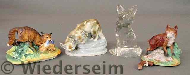 Appraisal: Clear glass fox figure and three ceramic foxes tallest h