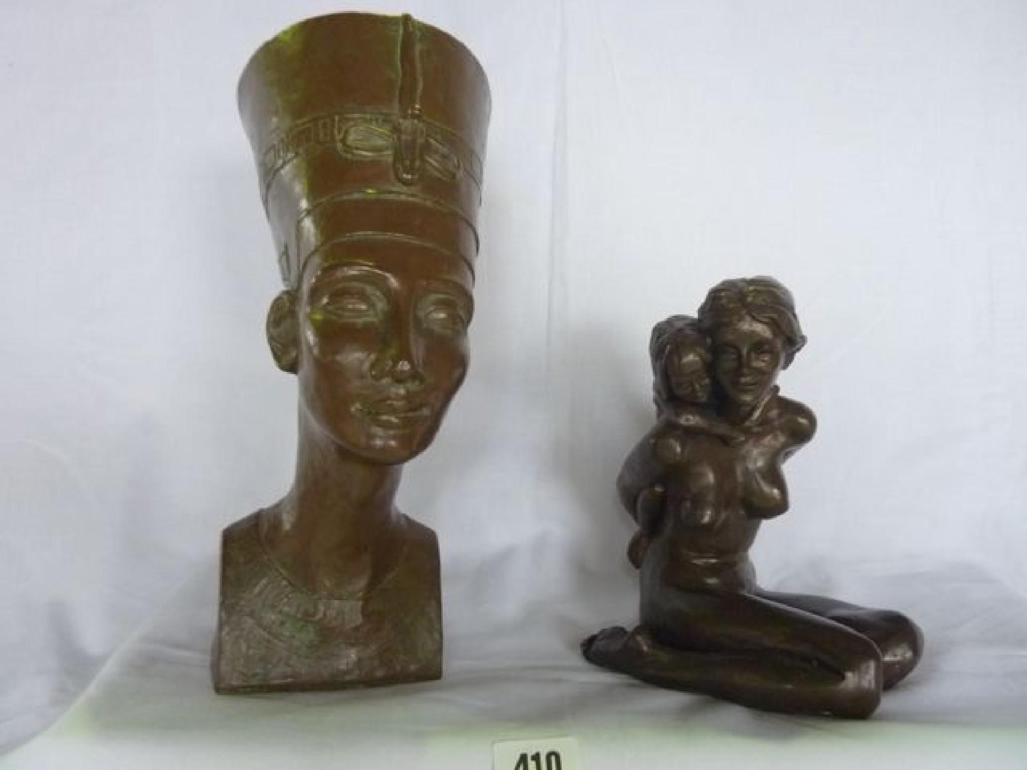 Appraisal: A resin figure of an Egyptian pharaoh's head and a