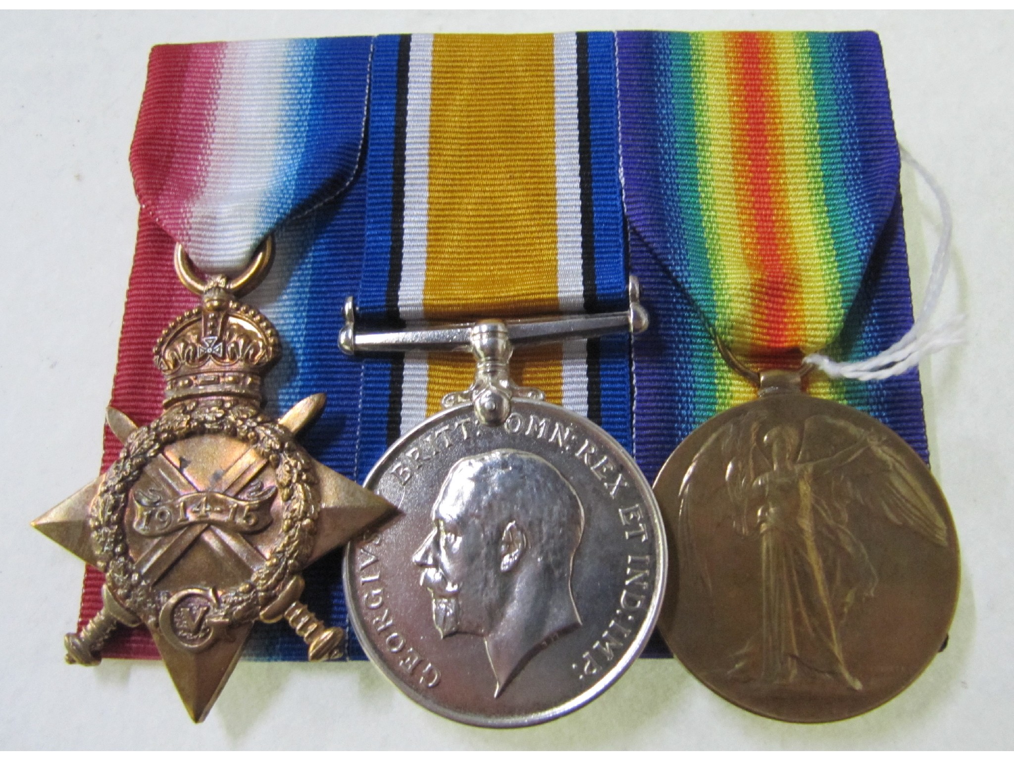 Appraisal: A WWI group of three to Gnr J H McKenzie