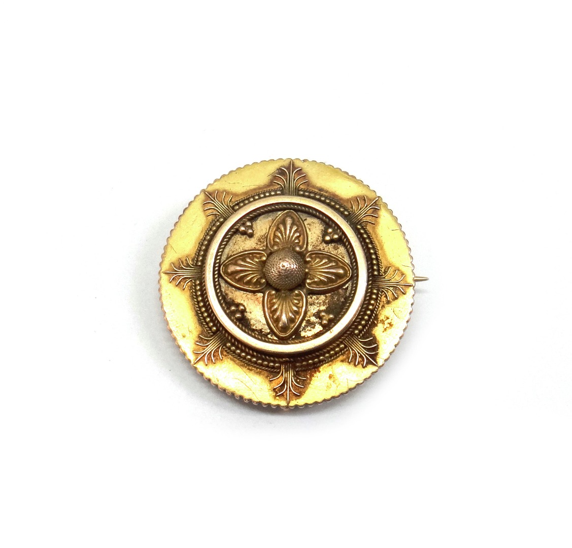 Appraisal: A Victorian gold circular brooch with classical ornament and a