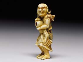 Appraisal: ANTIQUE IVORY NETSUKE Finely carved and well patinated antique ivory