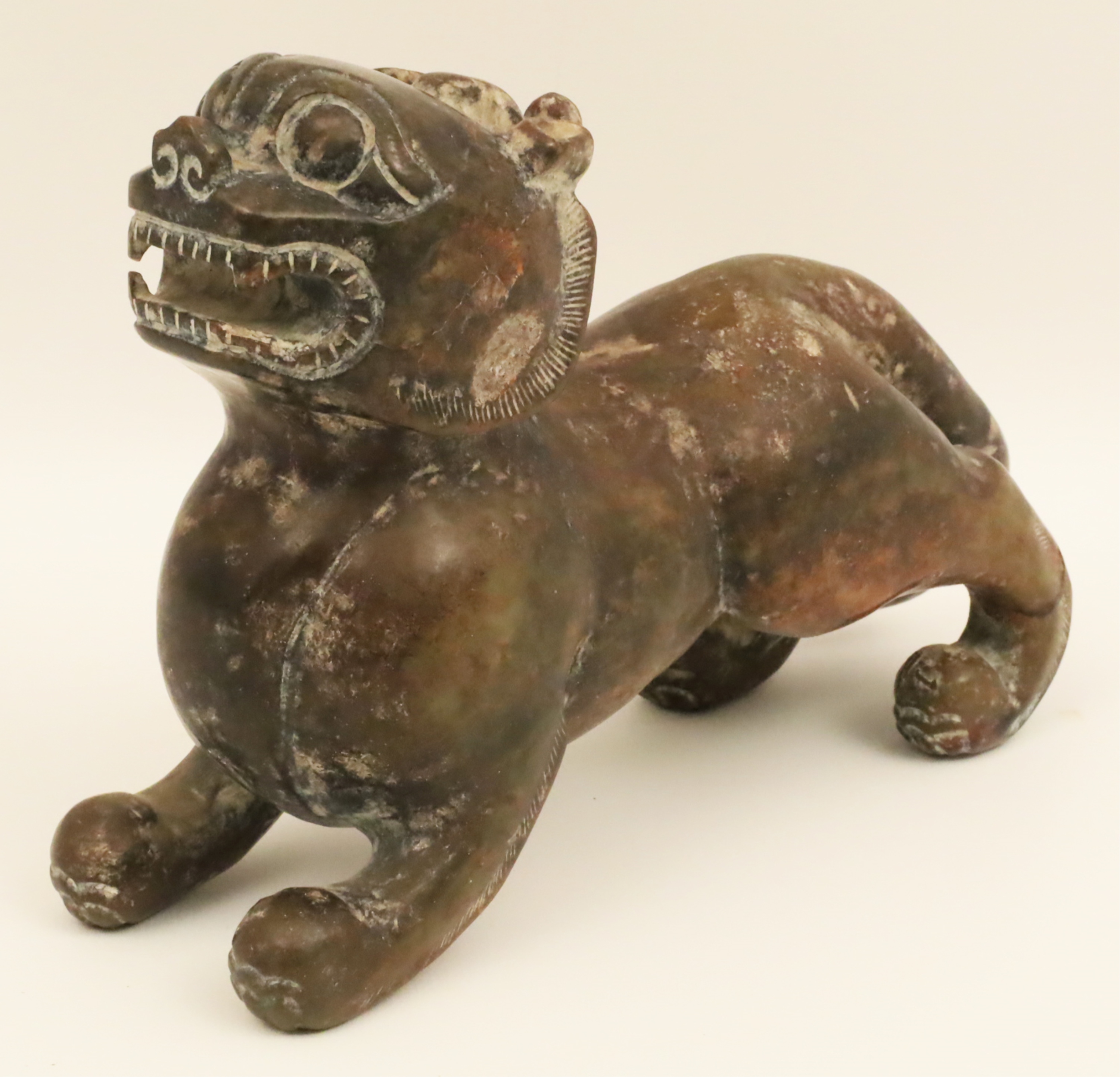 Appraisal: CHINESE CARVED STONE LION SCULPTURE Chinese carved stone lion sculpture