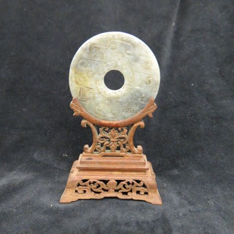 Appraisal: Chinese Carved Jade Disc serpent on one side symbols on