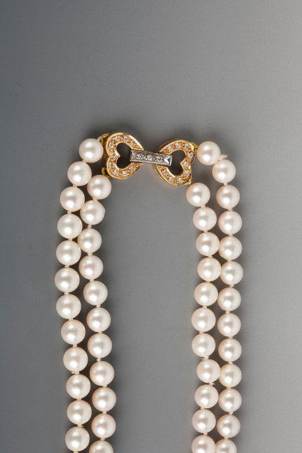 Appraisal: A DOUBLE ROW CULTURED PEARL NECKLACE with an ct gold