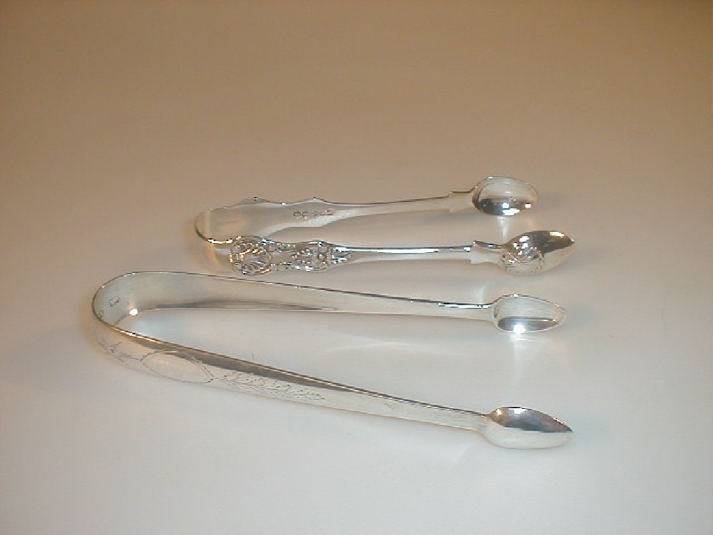 Appraisal: A pair of Victorian silver Kings pattern sugar tongs Newcastle