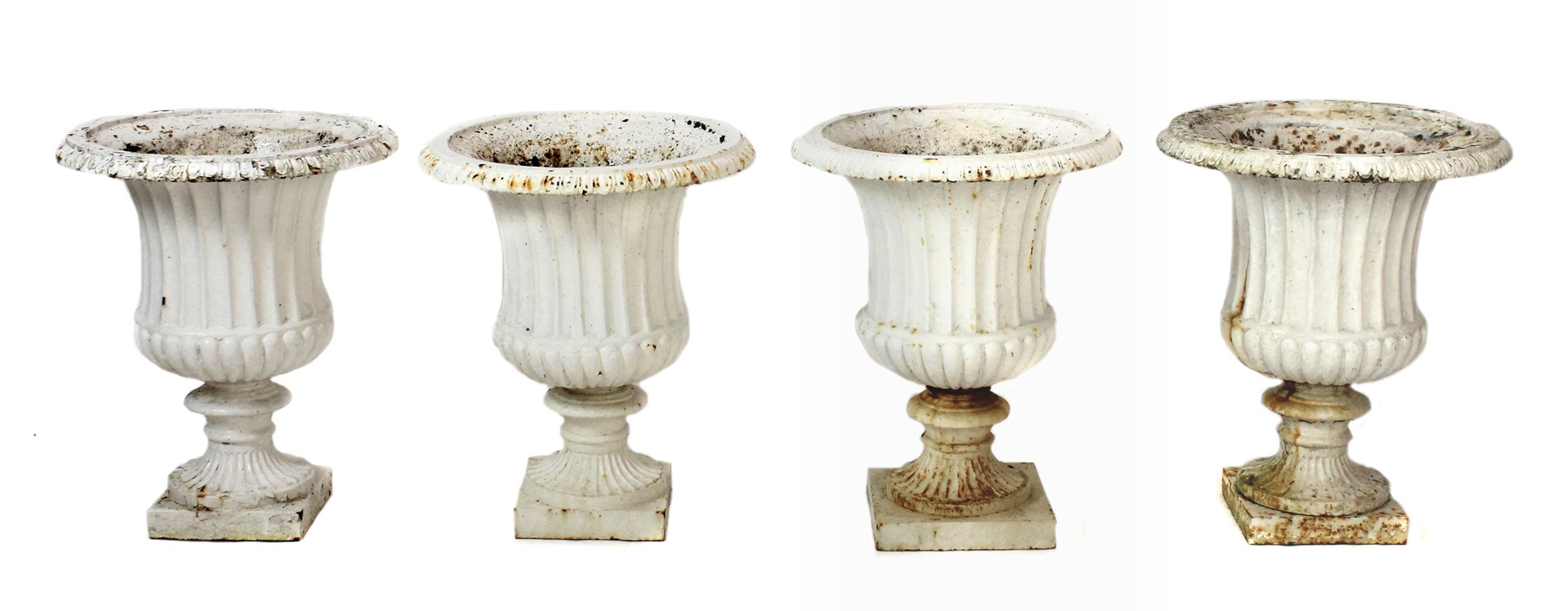 Appraisal: A set of four white painted cast iron garden urns