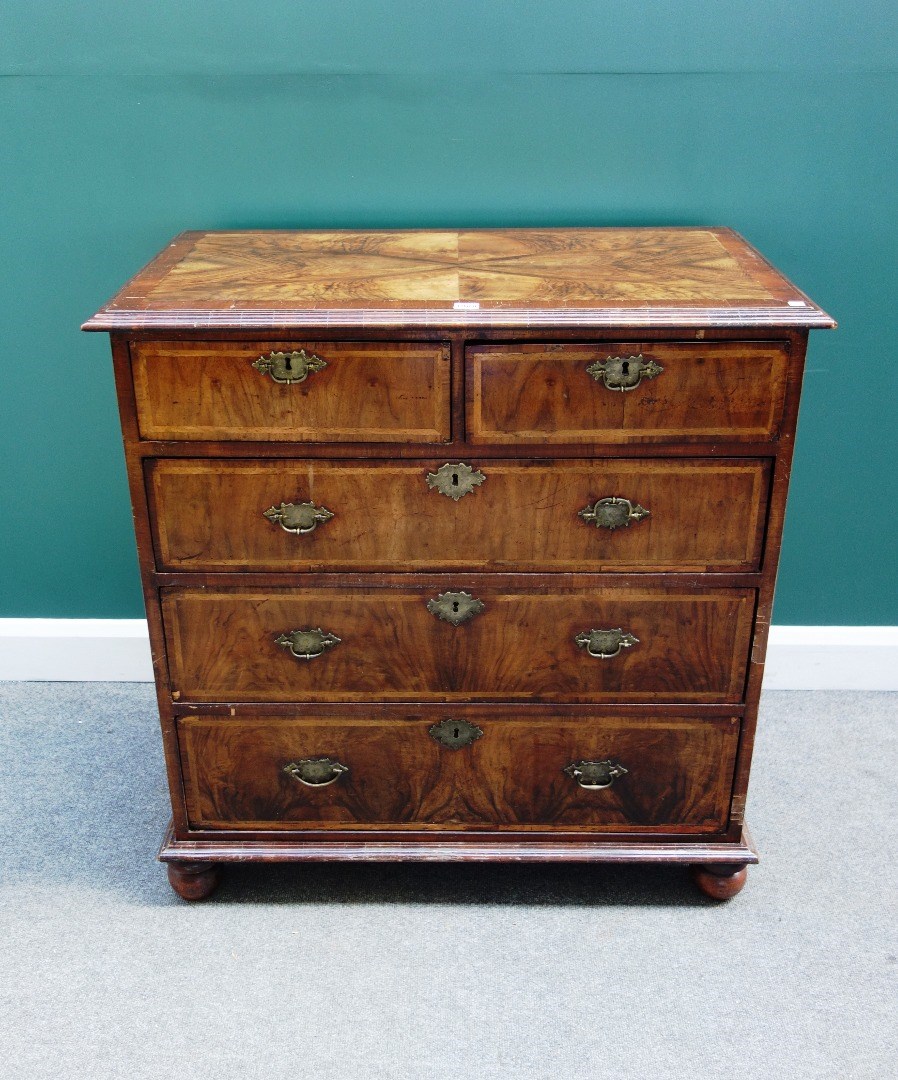 Appraisal: An early th century and later feather banded walnut chest