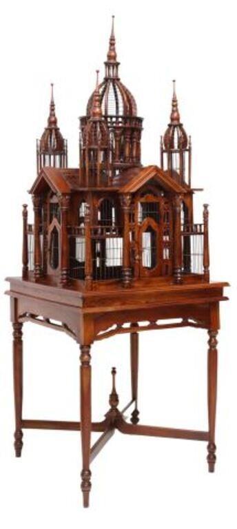 Appraisal: Architectural carved mahogany cathedral-form birdcage late th c having central