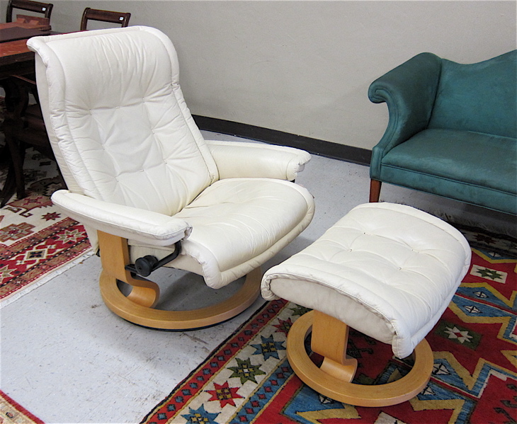 Appraisal: NORWEGIAN MODERN STRESSLESS SWIVEL RECLINER AND MATCHING OTTOMAN attributed to