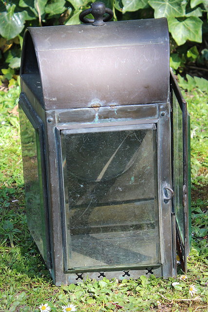 Appraisal: A BRASS THREE LIGHT STABLE LANTERN the arching top with