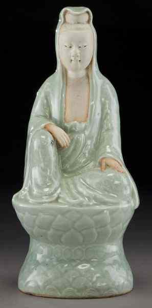 Appraisal: Chinese Qing celadon porcelain Guanyinseated on a lotus pedestal wearing