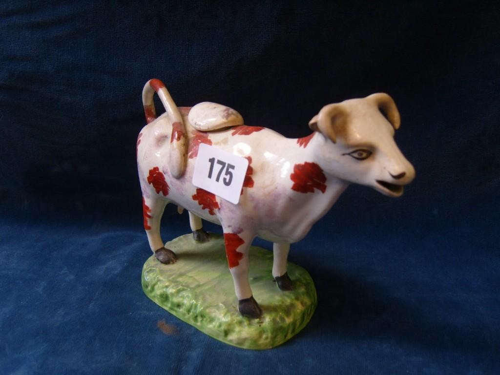 Appraisal: A th century cow creamer with red and pink lustred