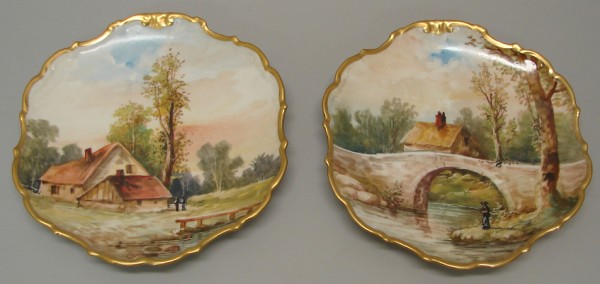 Appraisal: Hand painted platters feature landscape scenes One features a river