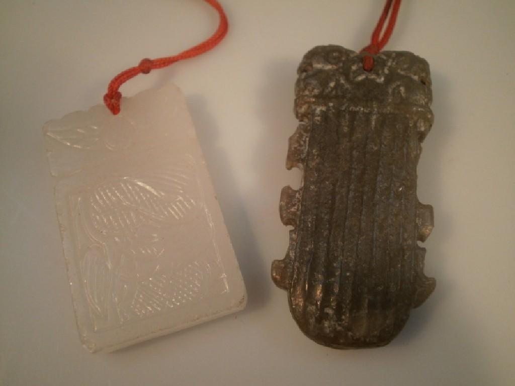 Appraisal: A rectangular Chinese jade pendant and another jade pendant