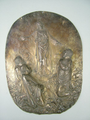 Appraisal: A Continental white metal oval panel with embossed decoration of