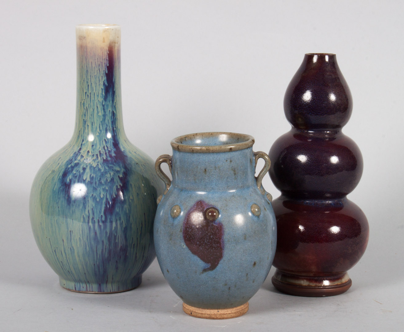 Appraisal: Three Chinese monochrome porcelain vases th th century flambe glazed