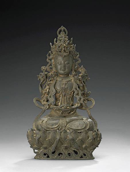 Appraisal: A cast bronze seated figure of Guanyin Ming Dynasty Attired