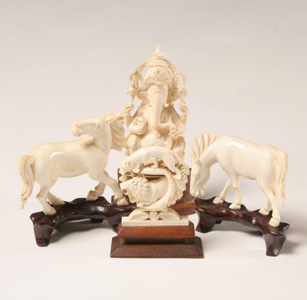 Appraisal: Carved ivory figures including an elephant saber tooth tiger and