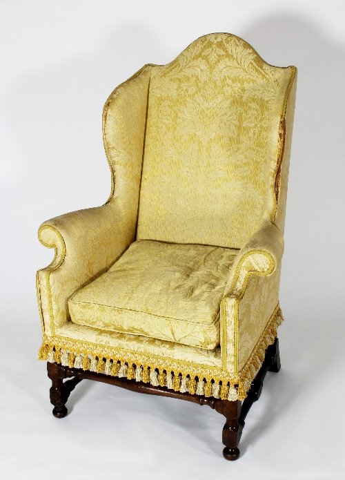 Appraisal: A Flemish walnut wing armchair circa on turned legs joined