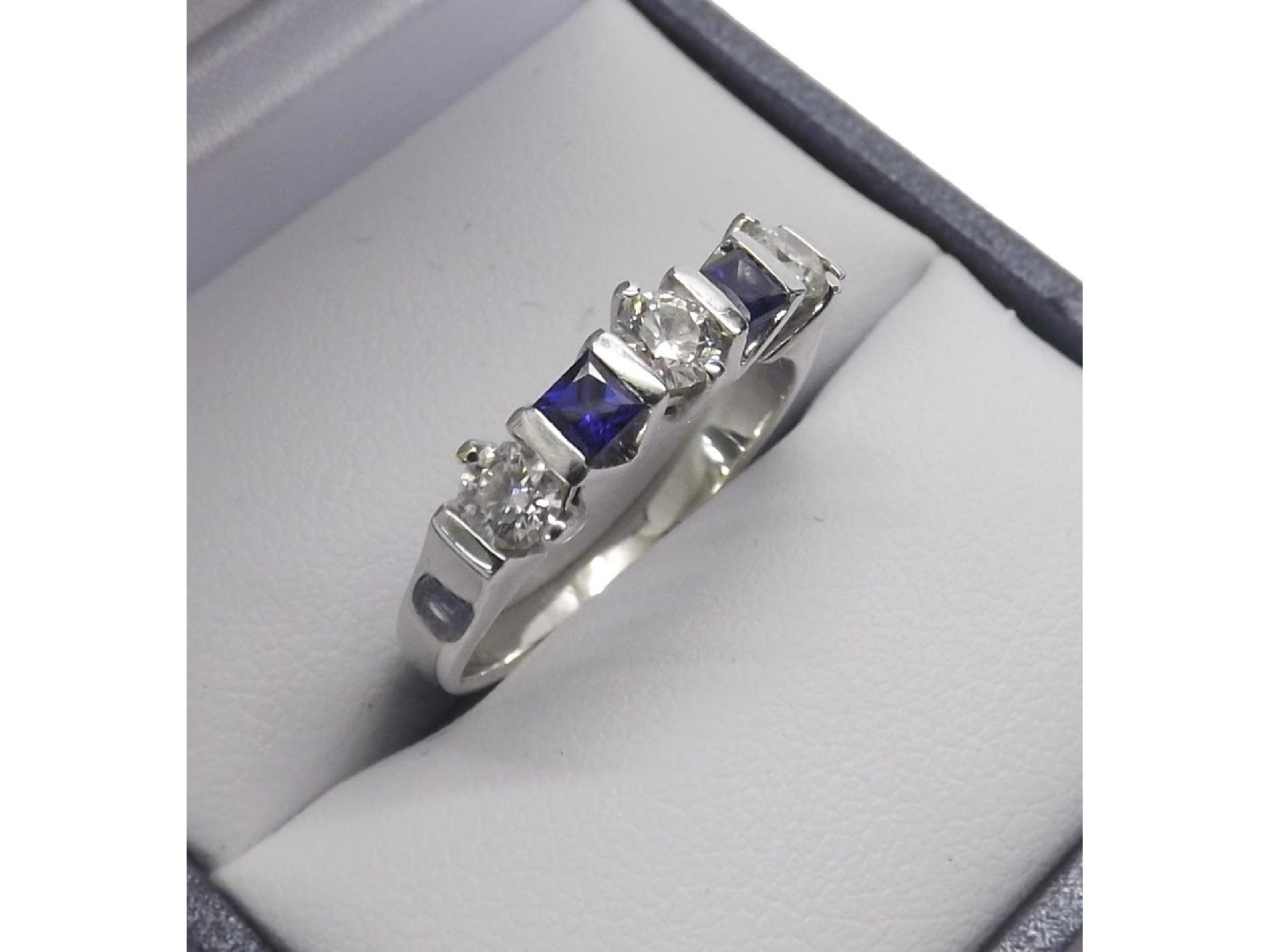 Appraisal: ct white gold sapphire and diamond ring with two princess-cut