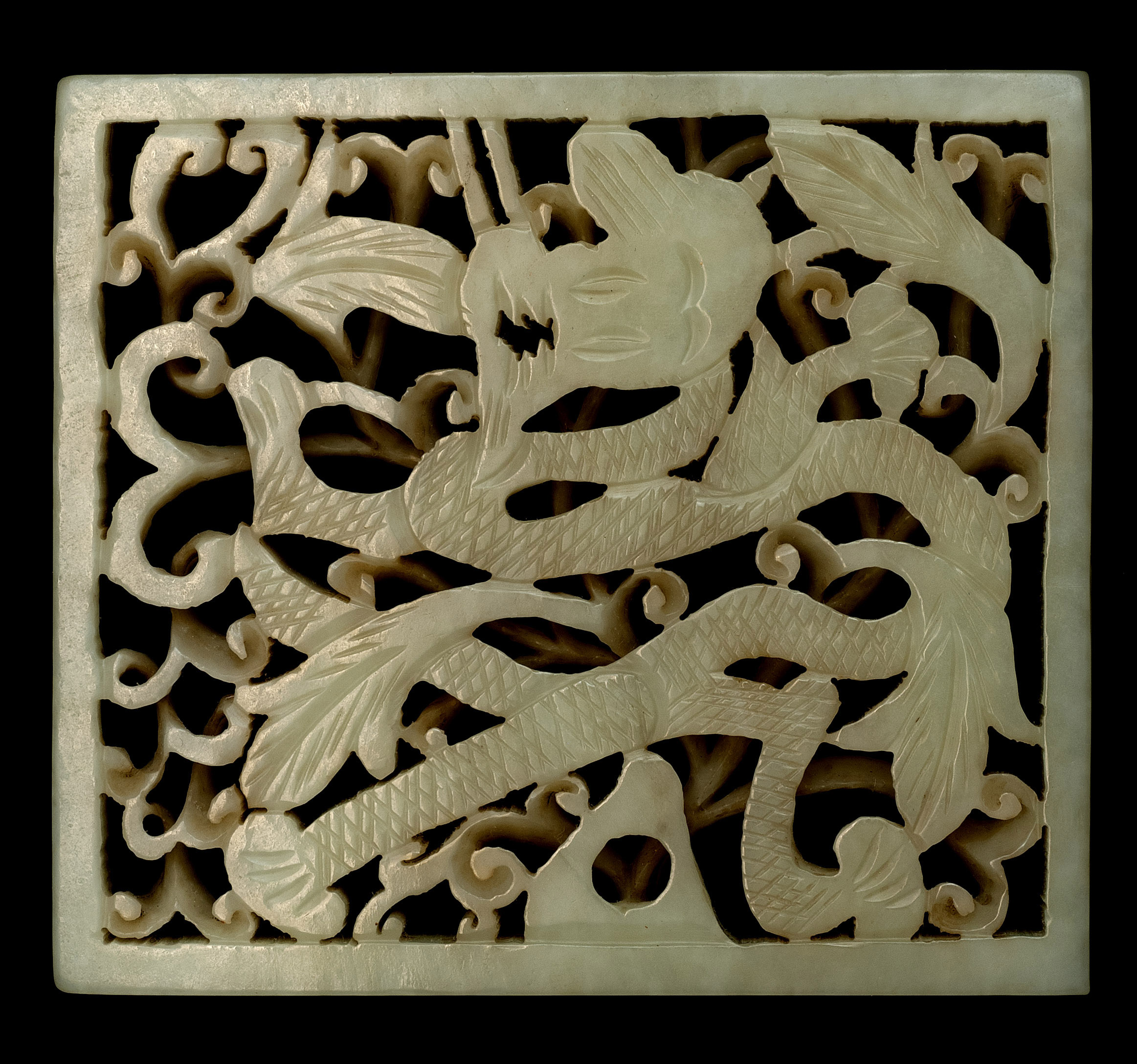 Appraisal: WHITE JADE PLAQUE In square form with pierced dragon design